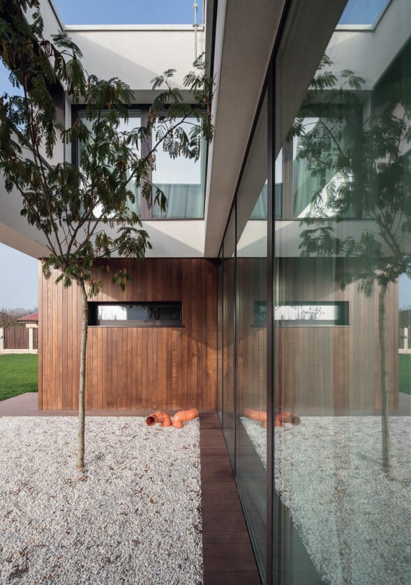 Contemporary entrance with aluminium glazing and timber cladding